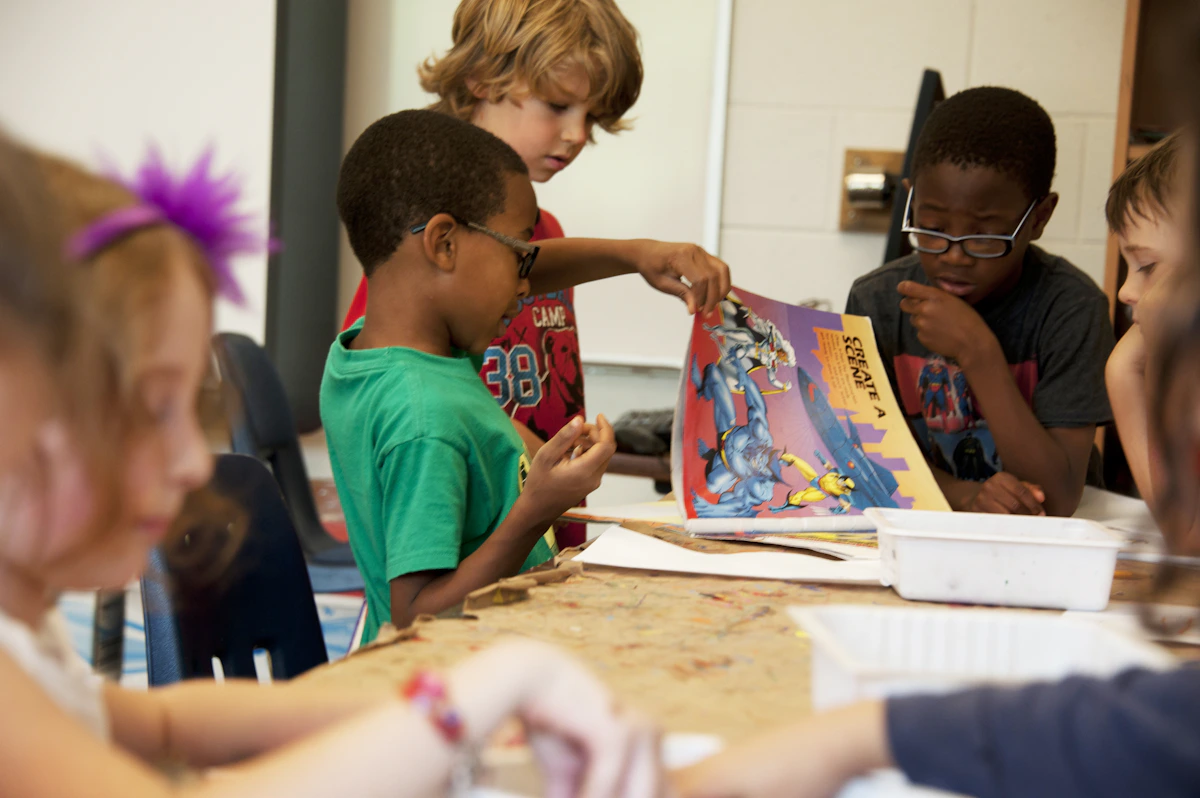 Illustrative photograph of pupils sharing a book and discussing ideas